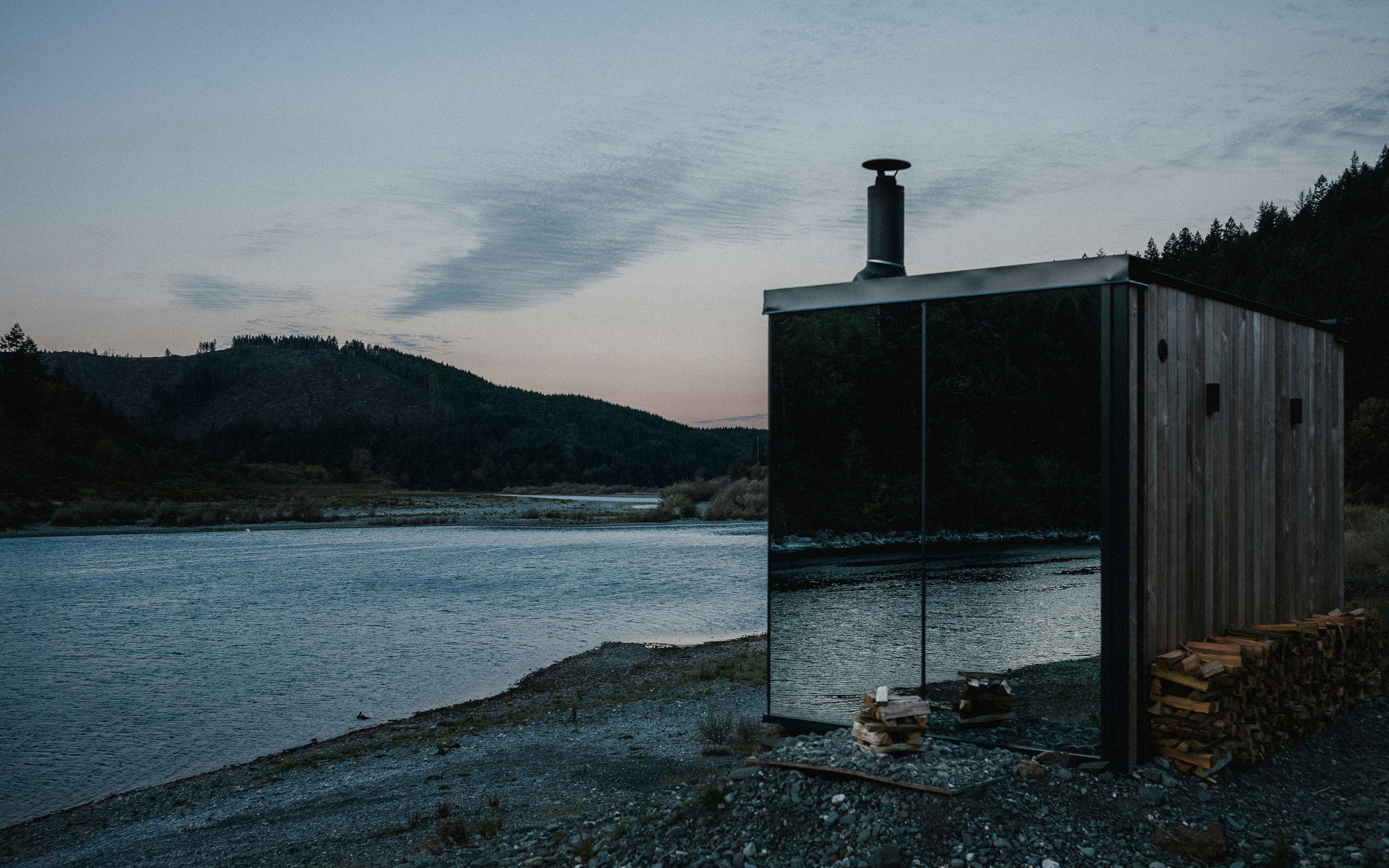 A mirror-walled sauna sits on the banks of the Rogue River at Tu Tu' Tun.